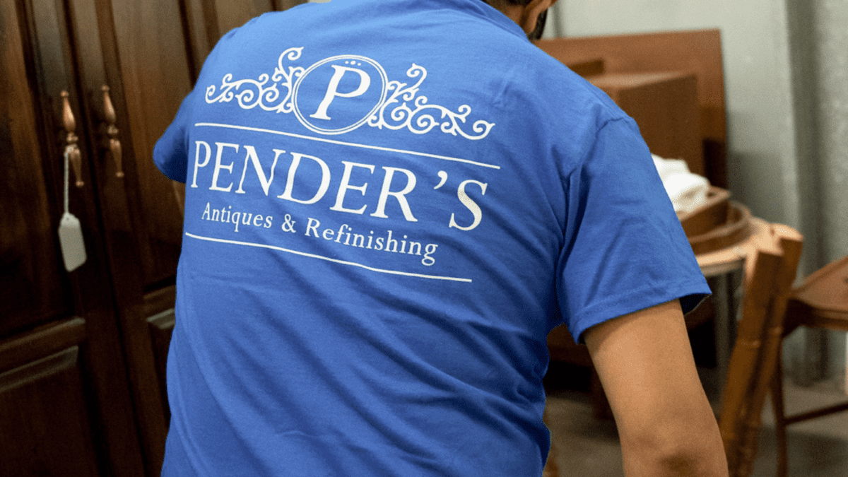 The back of a team member's shirt with the Pender's logo